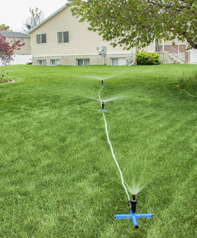 Orbit setup scene demonstrates portable irrigation ready for seasonal yard changes.