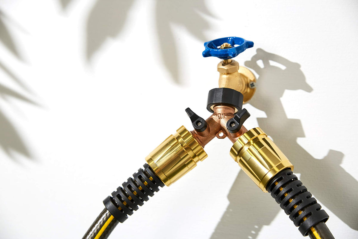 Orbit brass adapter with valve levers for independent flow control.