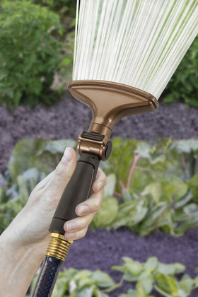 Orbit fan spray nozzle gardening scene demonstrating even coverage for a lush bed.