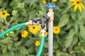 Orbit Hose Y Shut-Off Valve installation on faucet shows easy, tool-free attachment.