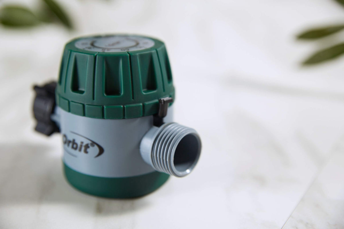 Orbit timer dial close-up shows oversized grip for easy adjustments.