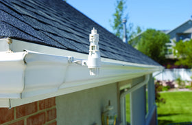 Orbit Rain and Freeze Sensor with wired connection to sprinkler controller pauses irrigation during adverse weather.