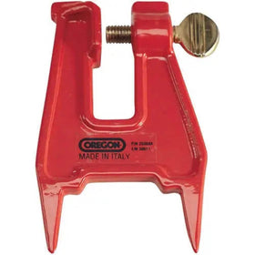Oregon filing vise on stump setup for secure bar clamping during field sharpening.