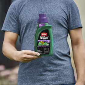 Ortho WeedClear concentrate pour spout in action for easy mixing.
