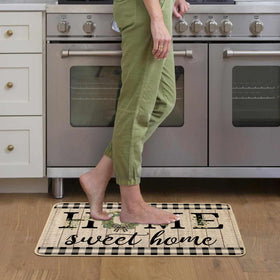 Cleaning close-up of ORTIGIA doormat showing easy shake-off and rinse.
