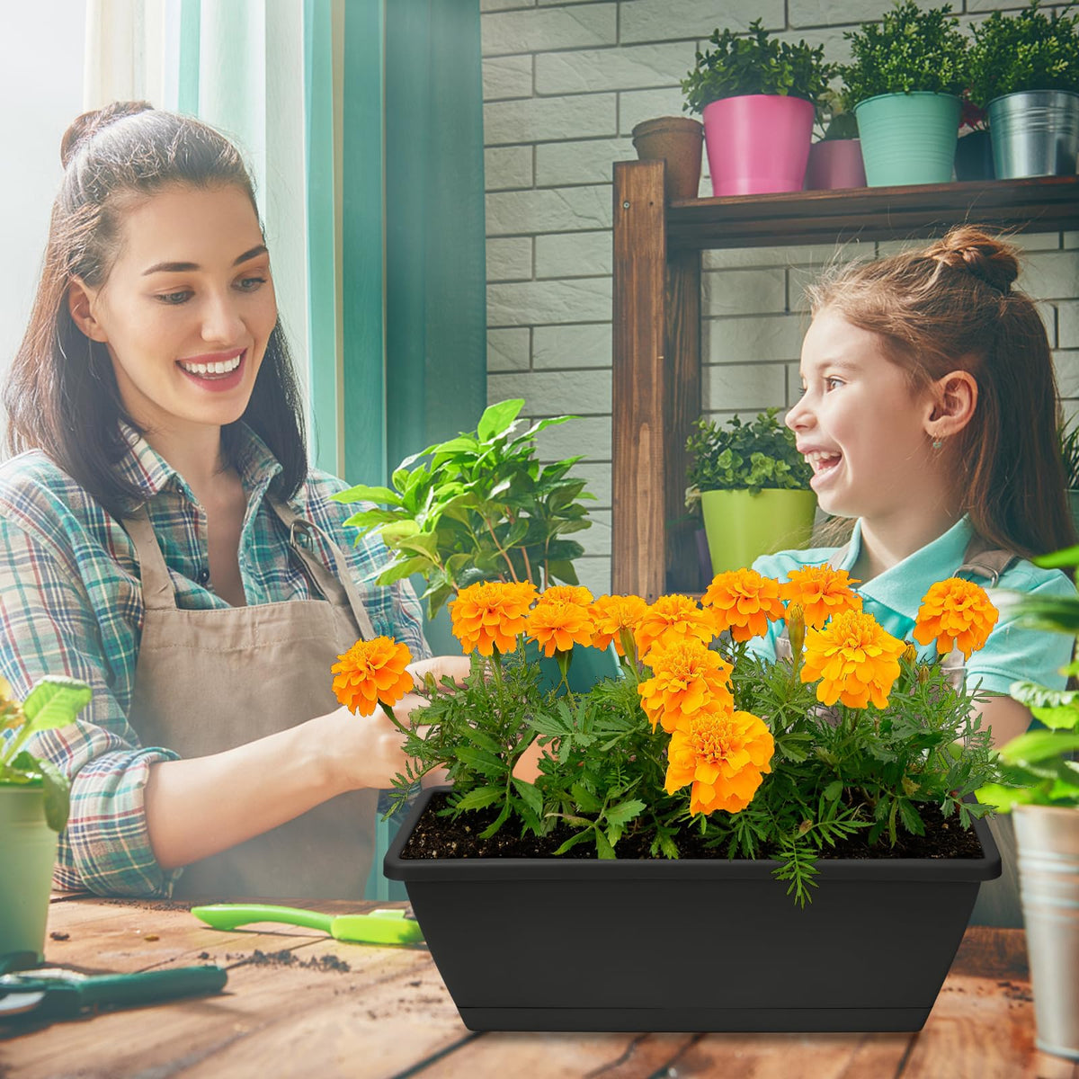 OSMOFUZE window box planter in dark gray adds modern decor touch.