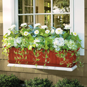 OSMOFUZE windowsill setup with multiple planters for a cohesive display.