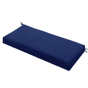 Ottowood navy bench cushion on a porch provides weather-ready comfort and durable color