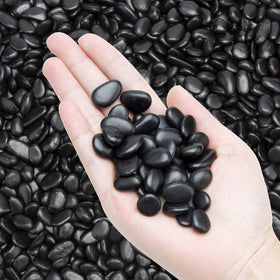 OUPENG black pebbles decorative gravel for garden beds and walkways.