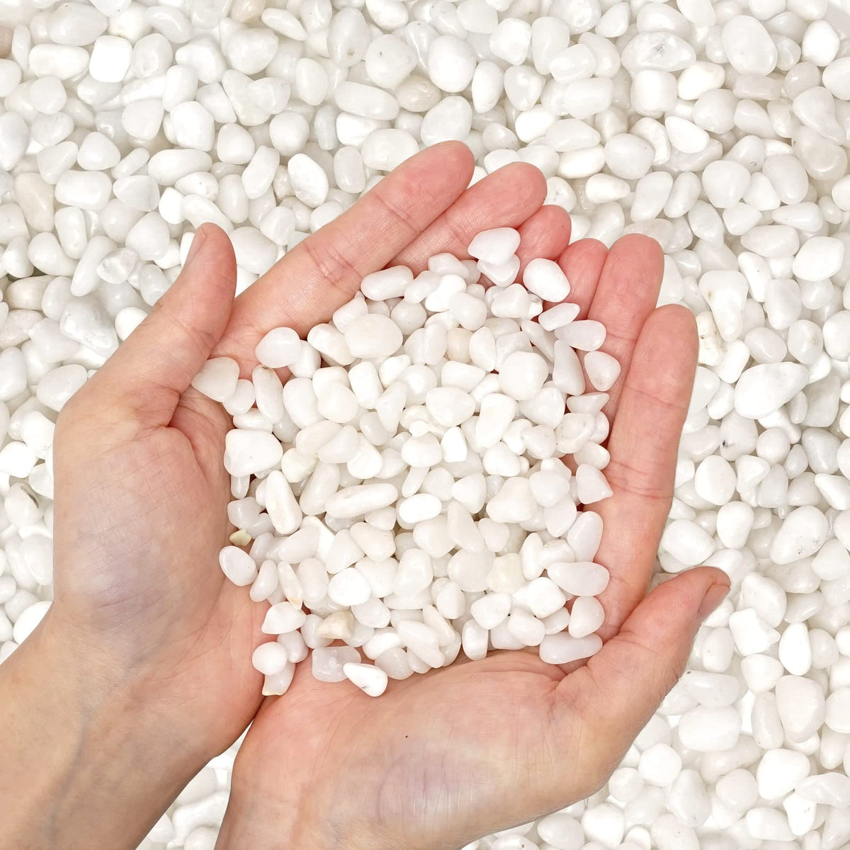 OUPENG white pebbles decorate pathways, pots, and garden beds with bright contrast.