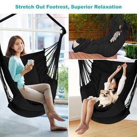 Outerman hammock chair comfortably sways under shaded patio for reading.