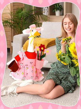 Outus goose statue on porch with gardener outfit for outdoor display.