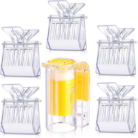 Outus queen clips and transparent cages for easy queen handling during hive work.