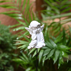 OwMell cherub memorial angel statue brightening garden spaces and pots.