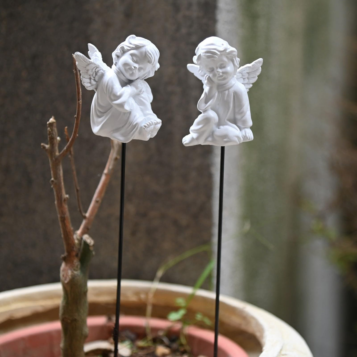 OwMell fairy garden angel adds whimsy to outdoor spaces.