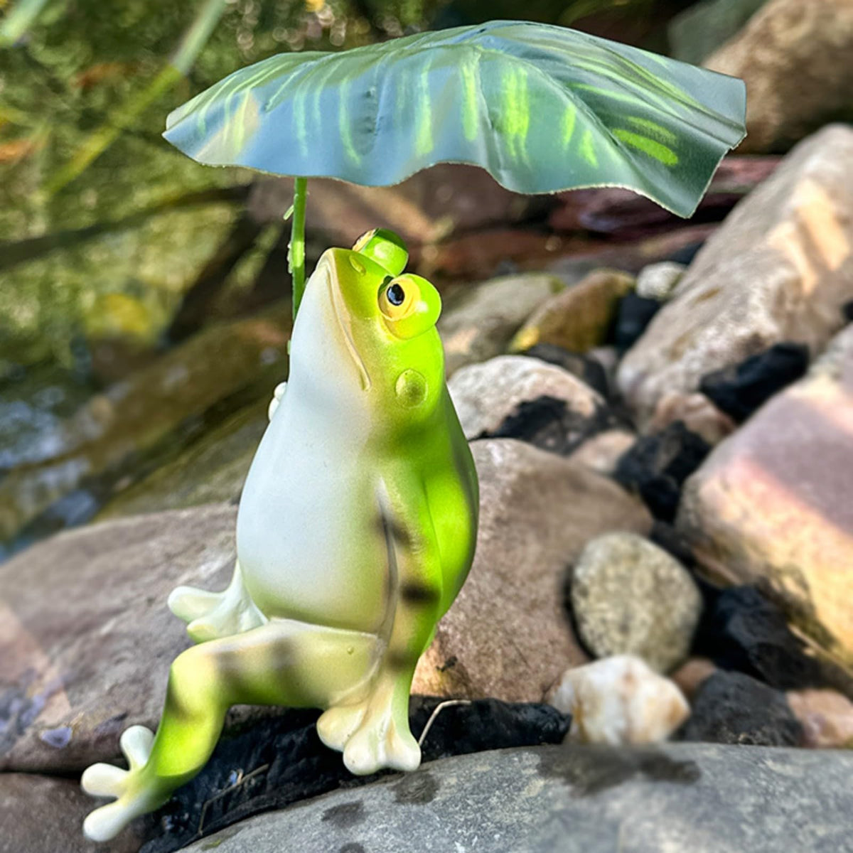 OwMell frog figurine on patio offers a playful focal point