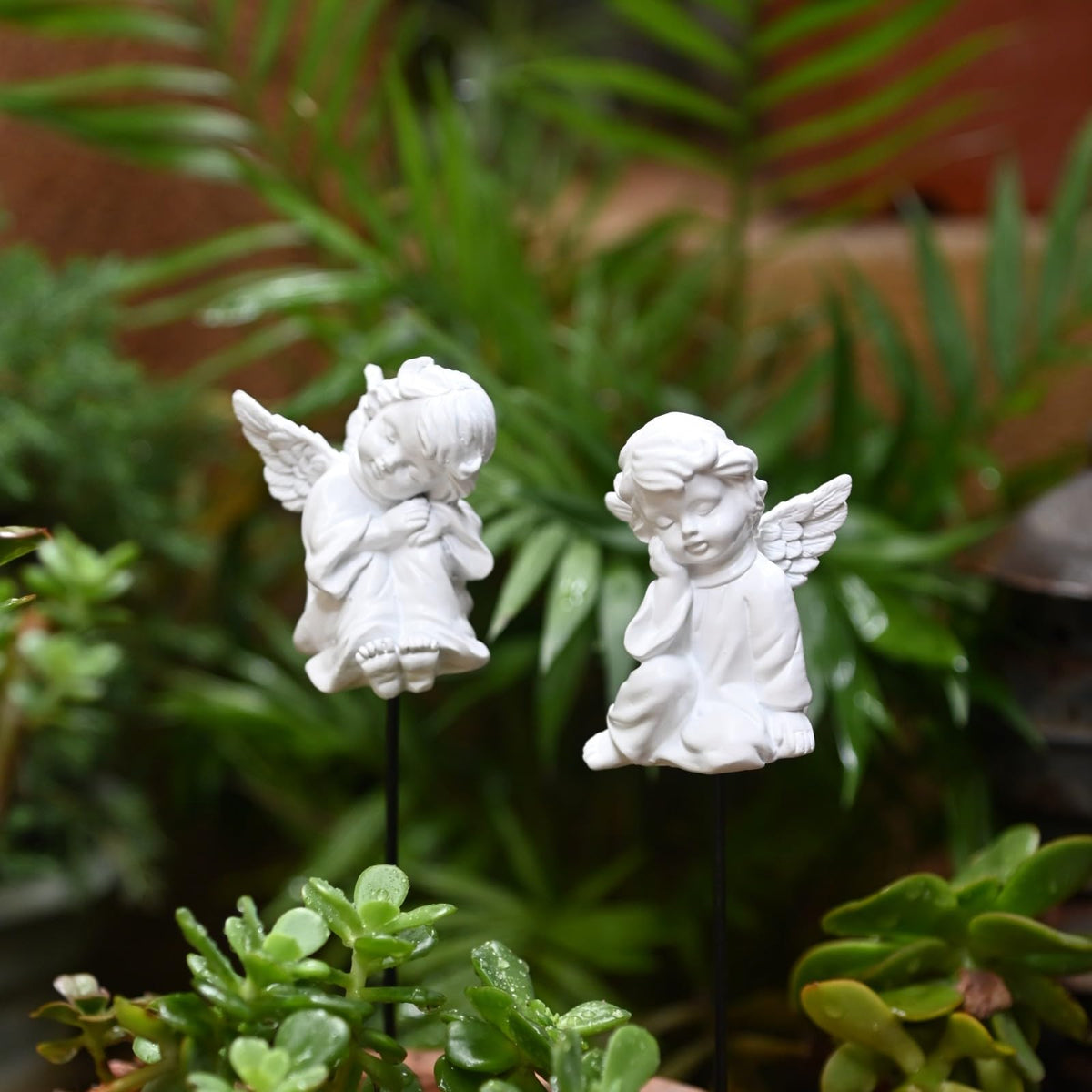 OwMell garden angel stake in white enhances outdoor decor.