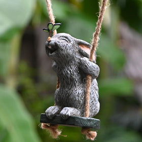 OwMell garden rabbit statue with butterfly swing adds whimsy to outdoor spaces.