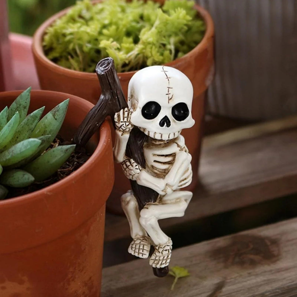 OwMell skeleton pot hugger perched on pot edge adds playful ambiance
