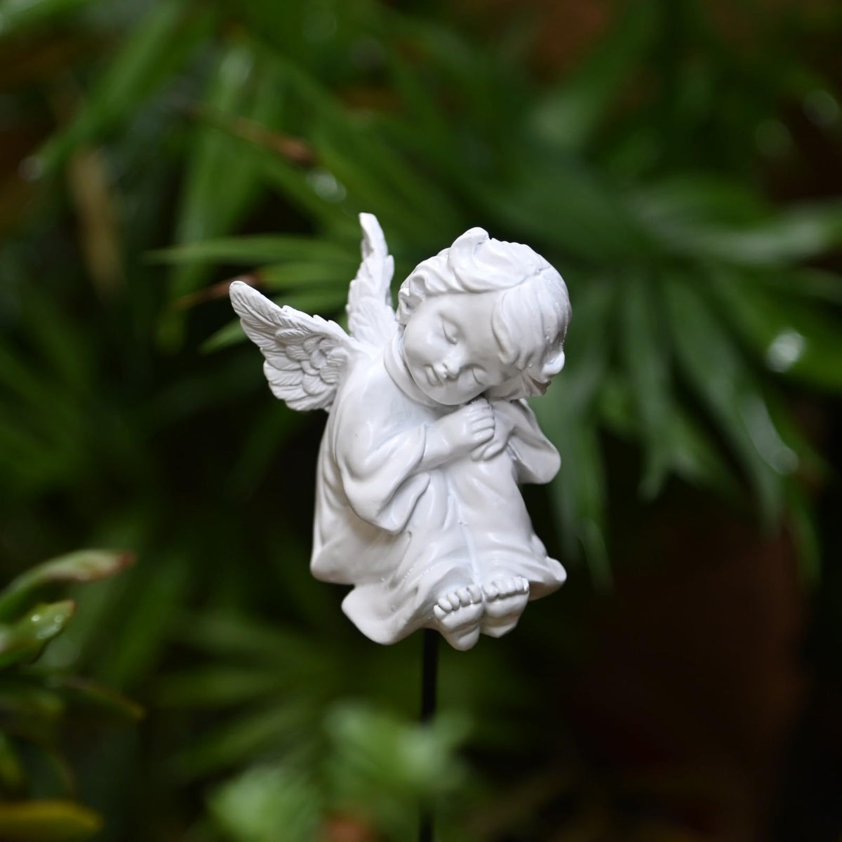 OwMell white angel ornament for pots offers gentle presence.