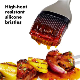 OXO Good Grips silicone bristles resist heat and odors for easy cleaning
