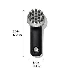 OXO Good Grips Cast Iron Brush highlights angled bristles for grooves and leverage.