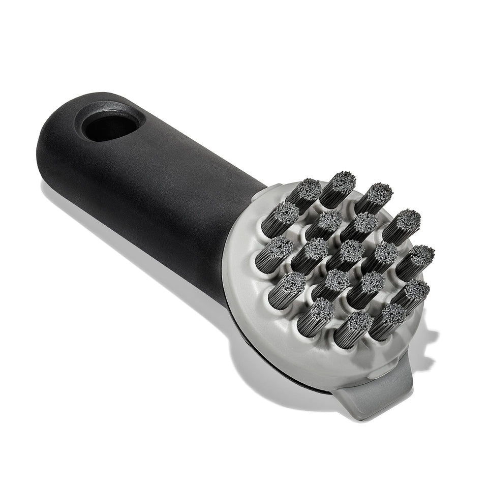 OXO Good Grips Cast Iron Brush shows smart bristle pattern for flat and ridged cookware.