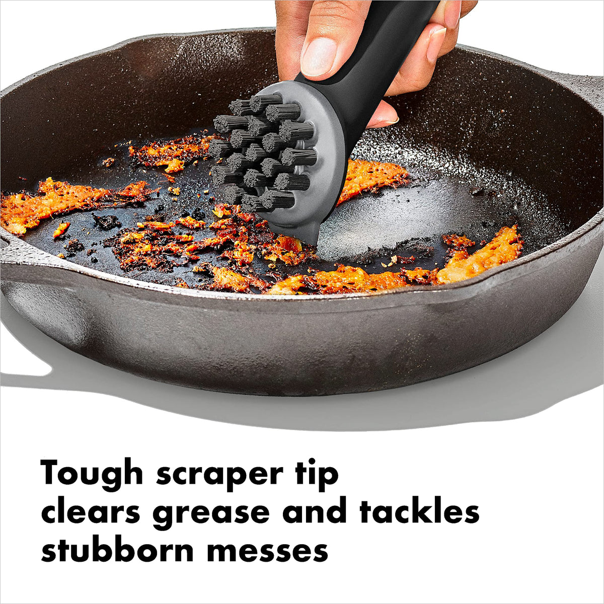 OXO Good Grips Cast Iron Brush designed for soap-free cleaning on cookware.