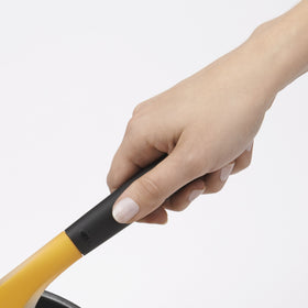 OXO Good Grips omelet turner in use gliding under eggs