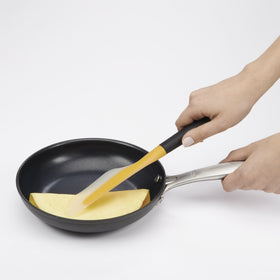 OXO Good Grips silicone head on a non-stick pan for safe cooking