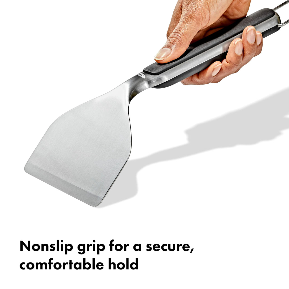 OXO Outdoor Griddle Scraper ergonomic handle for comfortable long cleaning sessions.