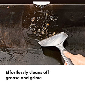 OXO Outdoor Griddle Scraper nonslip grip provides control while scraping grease.