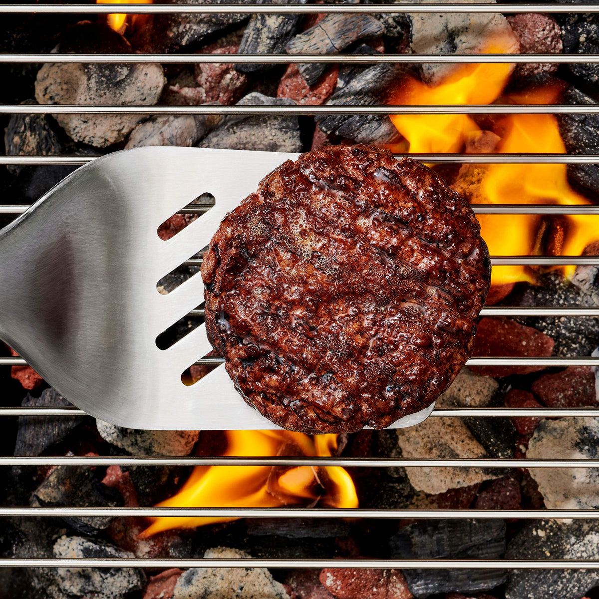OXO outdoor grilling tongs with scalloped edges for secure turning