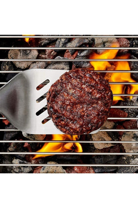 OXO Outdoor Grilling Turner offers balanced, ergonomic handling on the grill.