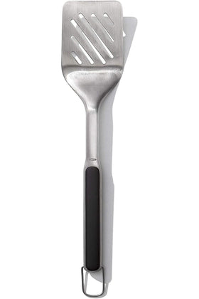 OXO Outdoor Grilling Turner has a wide beveled head that slides under foods.