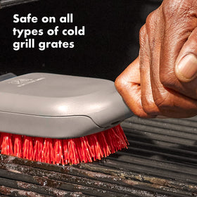 OXO grill brush stainless steel scraper with cut-outs clears burnt bits effectively.
