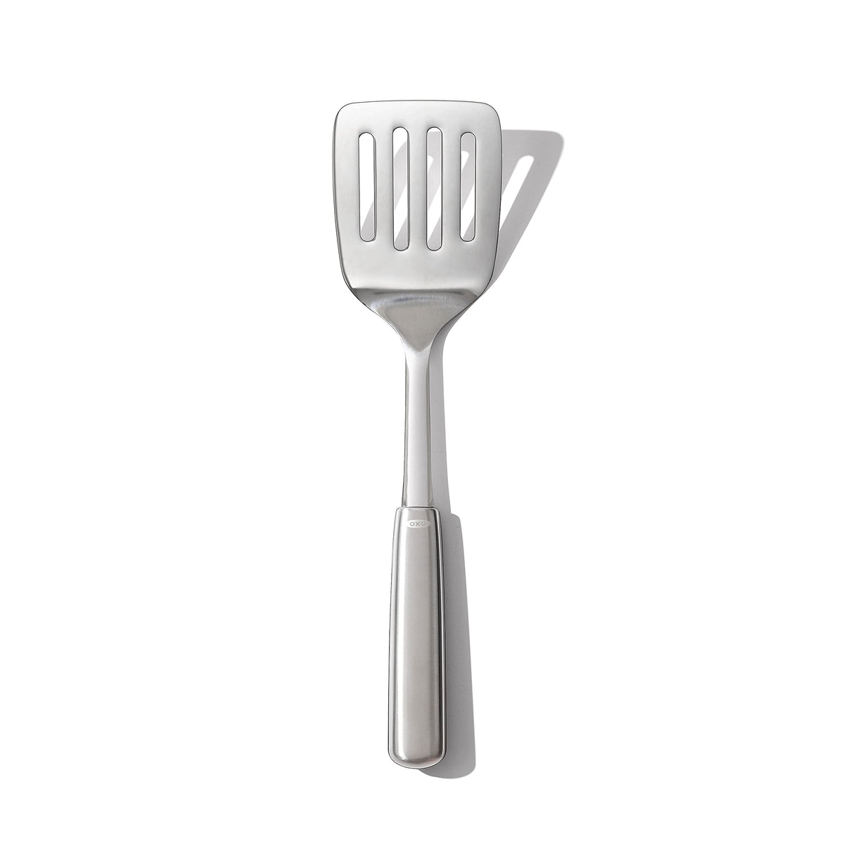 OXO Steel Cooking Turner head close up showing flexible under food design for easy lifting