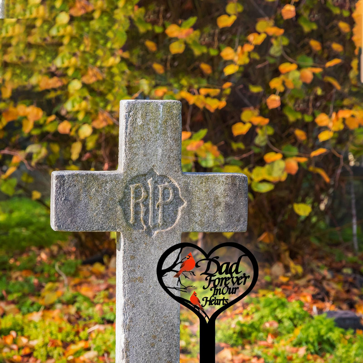 OZIO metal grave marker stands sturdy against rain and wind in the cemetery.