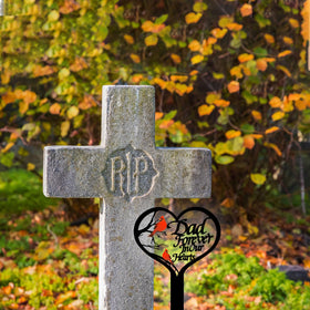 OZIO metal grave marker stands sturdy against rain and wind in the cemetery.