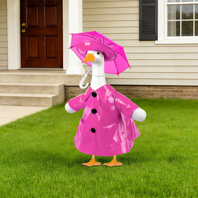 Paluqiya goose outfit pink raincoat with rainbow umbrella on garden statue, bright charm.