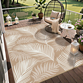 Pauwer leaf-pattern reversible outdoor rug updates patio decor quickly.