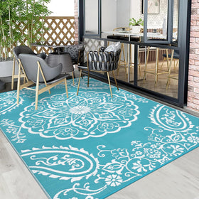 Pauwer outdoor rug in teal offers soft, cozy comfort underfoot on decks.