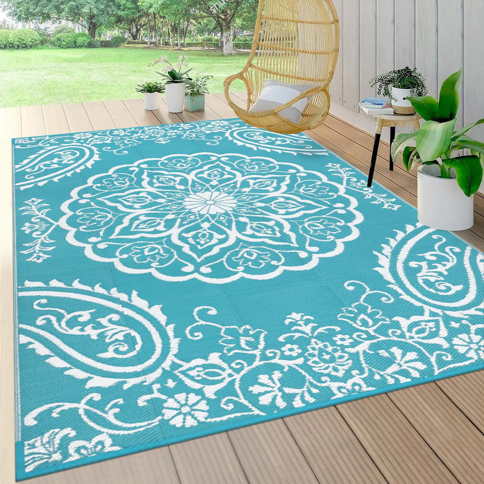 Pauwer waterproof outdoor rug 5x8 teal with reversible floral pattern for patio decor.