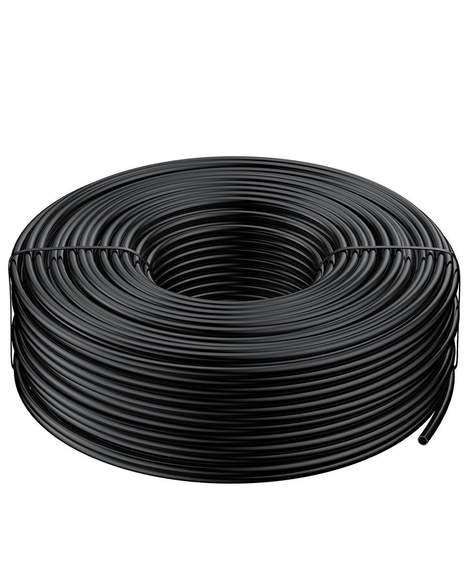 Pawfly 200 ft drip tubing unrolled in a garden for even watering.