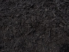 Rubber wood chips shaded by Peach Country Mulch Dye Midnight Black