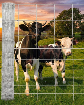 PeakPursuit livestock fence roll in pasture shows durable galvanized mesh for farm protection.
