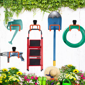 PeoMev wall-mounted rack on a fence demonstrates garden organization.