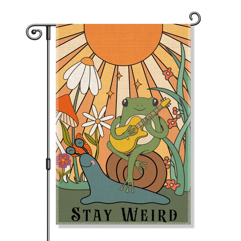Perfectinsoy Stay Weird flag with snail and frog design adds whimsy to garden.