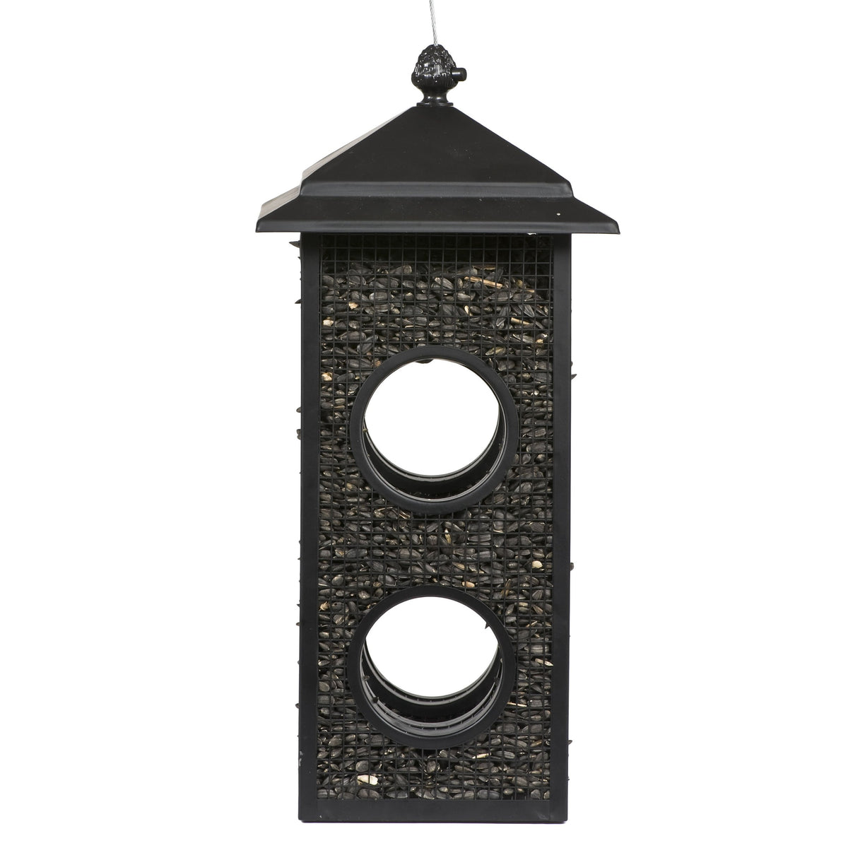 Perky-Pet Fly-Thru Feeder lid-cap system secures seeds outdoors for reliable feeding.