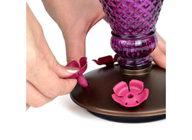 Perky-Pet gasket base prevents leaks for a tidy outdoor feeder.
